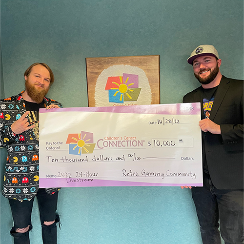 guys from gaming off the grid present a check to CCC