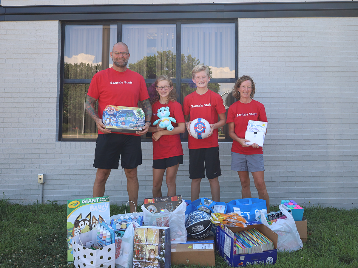 family donating toys and supplies