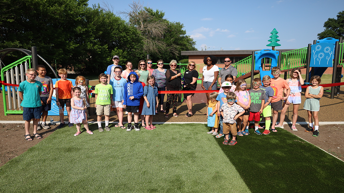 photo of CCC, Variety and kids cutting ribbon on playground