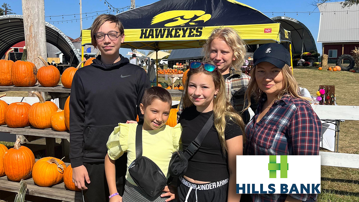 photo of family at outing with hills bank logo