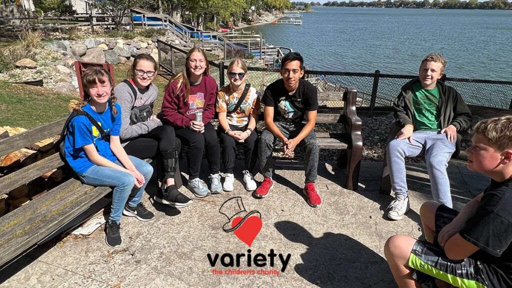 photo of teens on a bench and variety logo