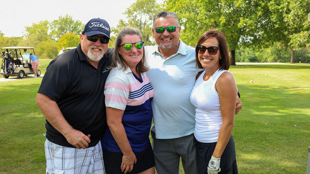 photo of golf team smiling