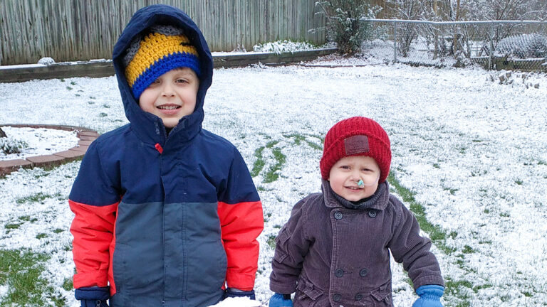 photo of henry and evan oppman in the snow