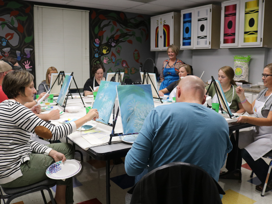 parents painting at comfort connection